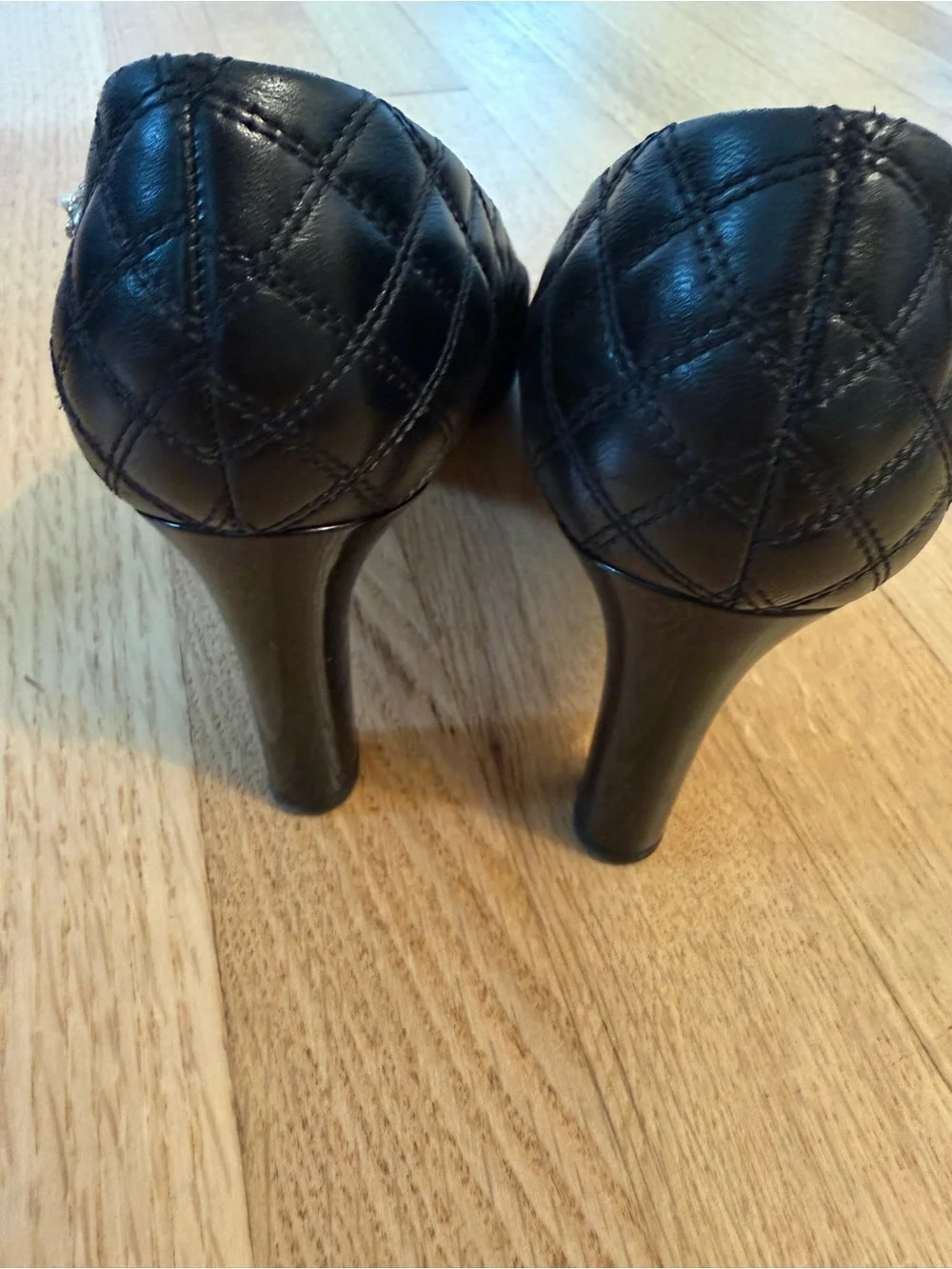 CHANEL Black Quilted Leather Cap-Toe Pumps with Patent CC